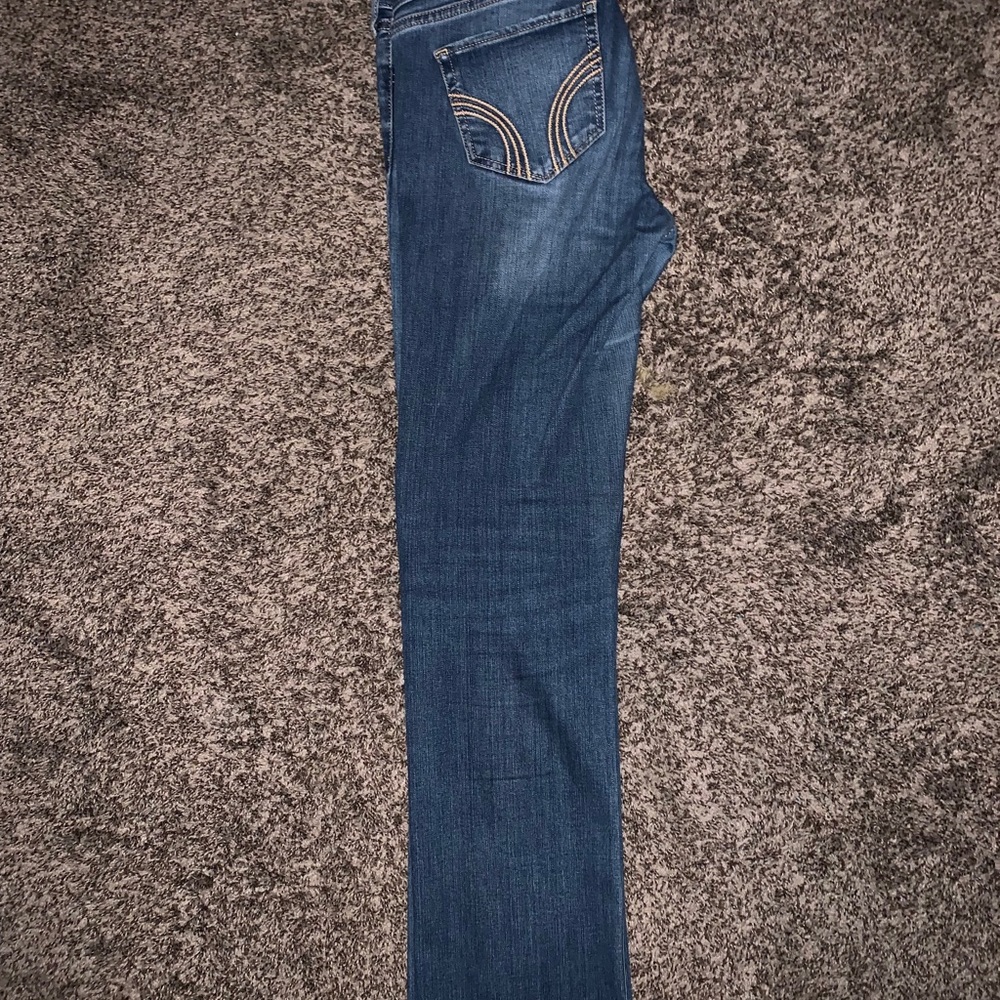 Distressed bootcut blue jeans